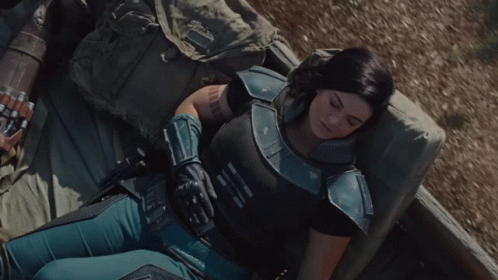 Woman in Armor Lying on Bed
