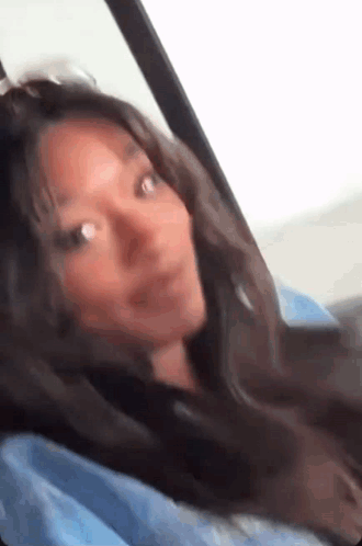 Woman in Back Seat Looking Out Window