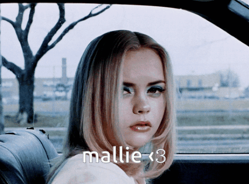 Woman in Back Seat of Car With Name Mallie < 3