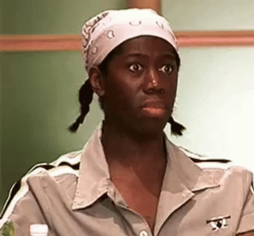 Woman in Bandana and Braids Making Funny Face