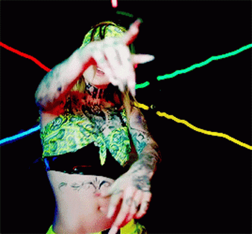 Woman In Bandana And Crop Top Dancing In Dark Room GIF