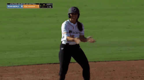 Woman in Baseball Uniform on Field