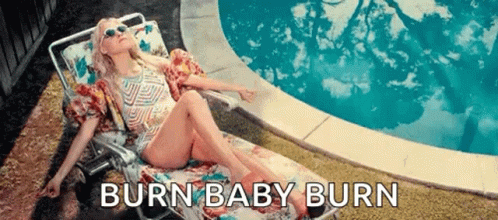 Woman in Bathing Suit Lying by Pool Burn Baby Burn