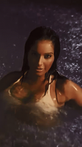 Woman In Bathing Suit Standing In Pool GIF