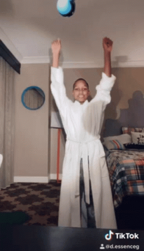 Woman in Bathrobe Arms in Air TikTok Watermark