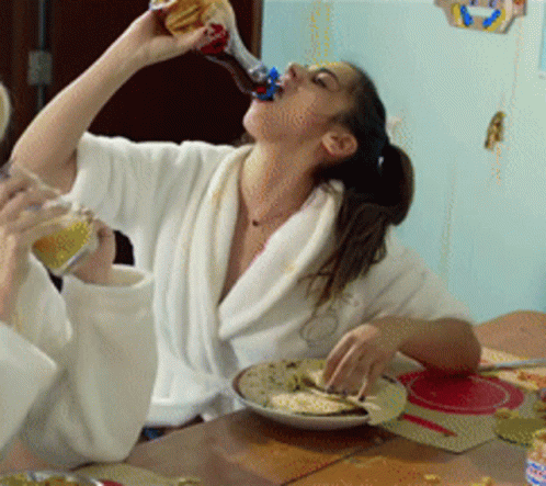 Woman in Bathrobe Drinking Coca Cola