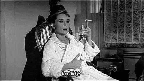 Woman in Bathrobe Rocking With Water and Paper