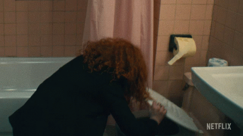 Woman in Bathroom with Netflix Logo