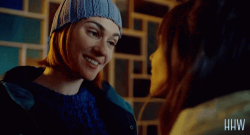 Woman in Beanie and Blue Sweater Saying And If That's Our Destiny
