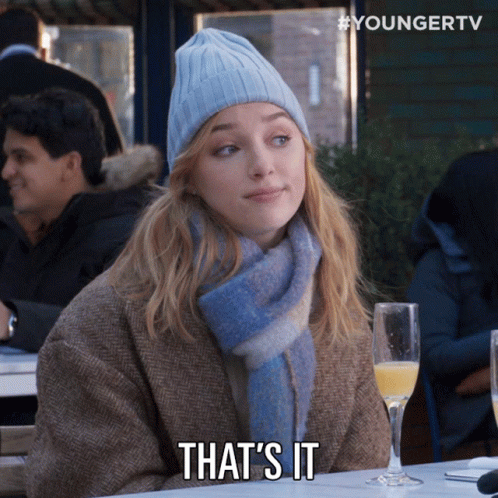 Woman In Beanie And Scarf Says That GIF