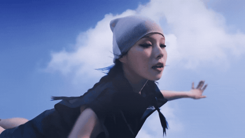 Woman In Beanie Flying GIF