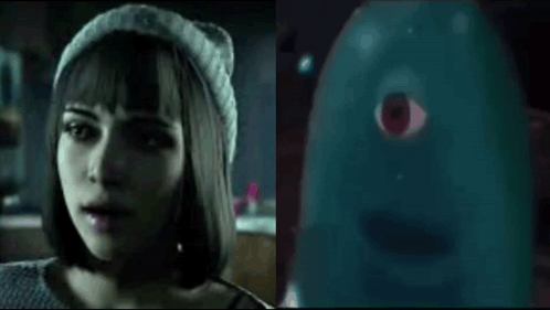 Woman In Beanie Talking To Blue Ghost With Red Eye GIF