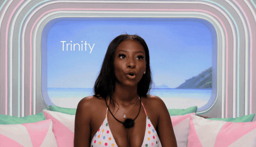 Woman in Bikini by Window With Trinity