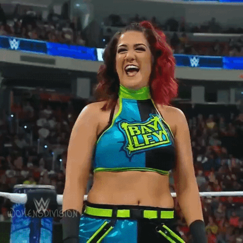 Woman in Bikini Holding Bayley in the Bank Sign