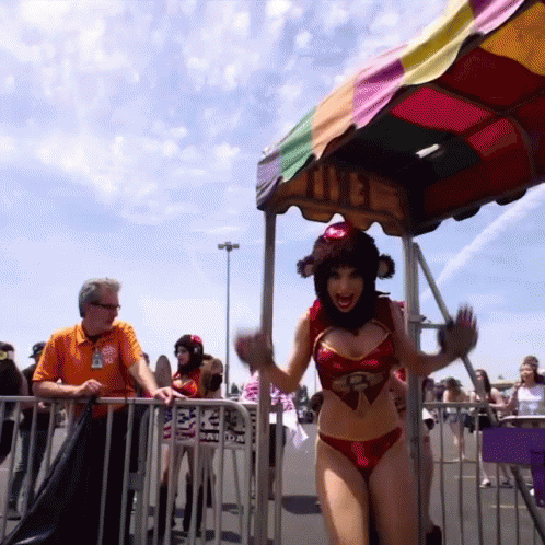 Woman in Bikini in Front of Colorful Canopy