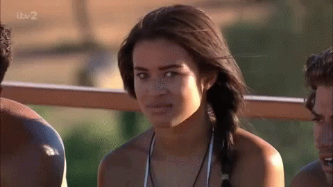 Woman In Bikini Poses For Camera With Two Men GIF