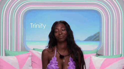 Woman in Bikini Sitting by Window with Trinity