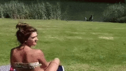 Woman in Bikini Sitting in Grass