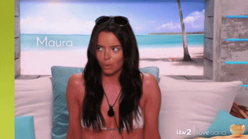 Woman in Bikini Sitting on Couch Maura