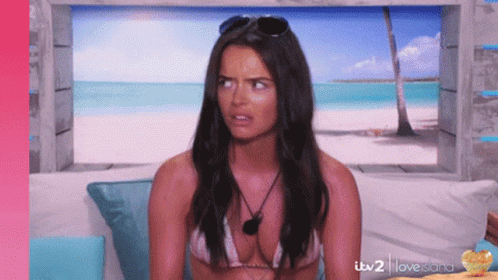 Woman In Bikini Sitting On Couch With ITV 2 Love Island GIF