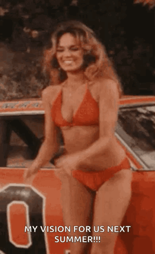 Woman In Bikini Standing In Front Of Red Car GIF