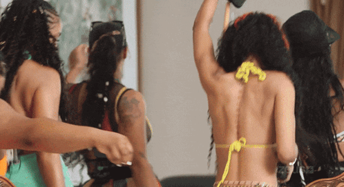 Woman In Bikini With Yellow String Necklace GIF
