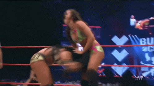 Woman in Bikini Wrestling Ring All In Bullet Club
