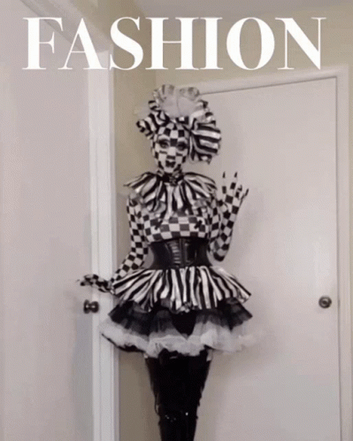 Woman in Black and White Checkered Dress With Fashion Sign