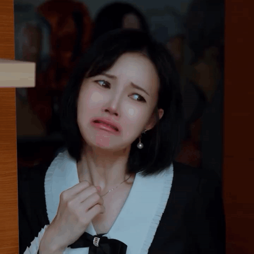 Woman in Black and White Dress Making Face