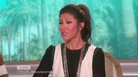 Woman in Black and White Dress on Talk Show