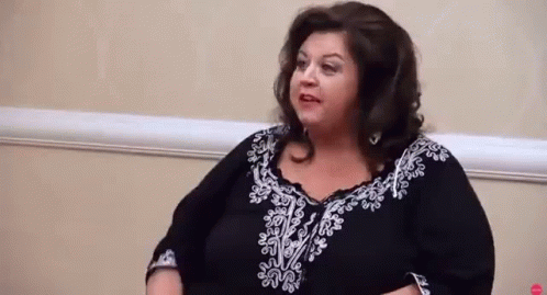Woman in Black and White Dress Talking