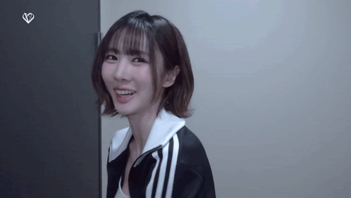 Woman in Black and White Jacket Smiling
