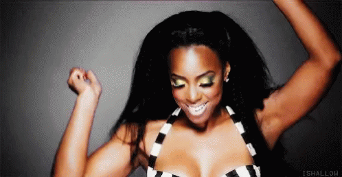 Woman in Black and White Striped Top Dancing With Arms Up