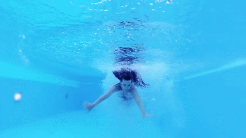 Woman in Black Bikini Swimming