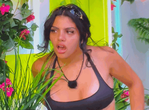 Woman in Black Bikini Top in Flower Garden