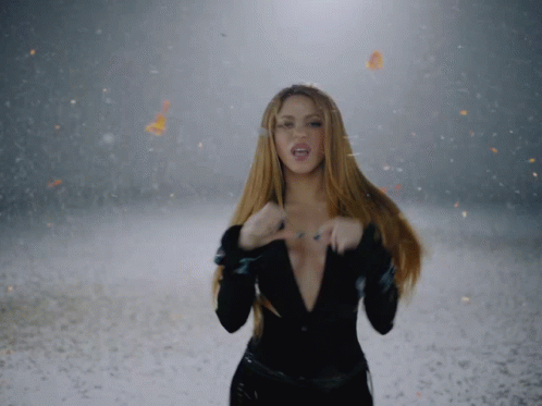 Woman in Black Bodysuit in Snow with Butterflies