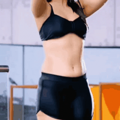 Woman in Black Bra and Shorts in Gym