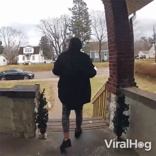 Woman in Black Coat Walking Down Porch Viralhog