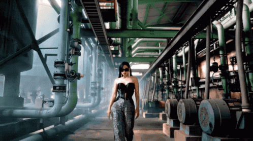 Woman in Black Corset Walking Through Green Pipes