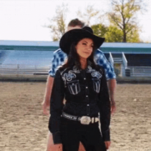 Woman In Black Cowboy Hat And Black Shirt GIF