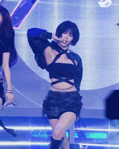 Woman in Black Crop Top and Shorts Dancing