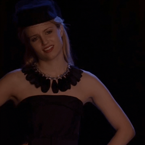 Woman in Black Dress and Hat Smiling