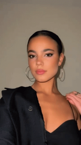 Woman in Black Dress and Hoop Earrings
