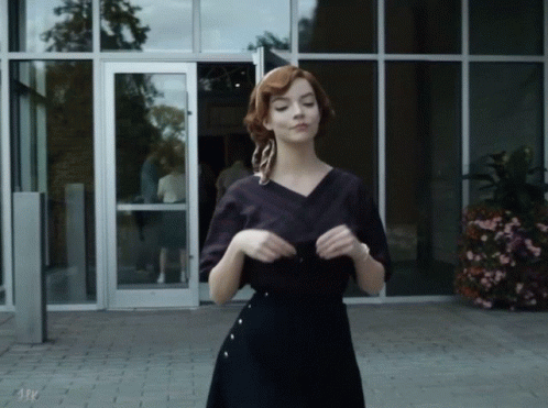 Woman In Black Dress At A & P Sign GIF