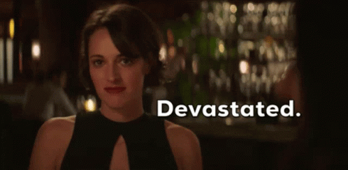 Woman in Black Dress at Bar Devastated
