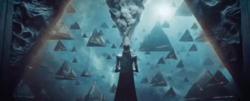Woman in Black Dress Before Pyramid in Darkness