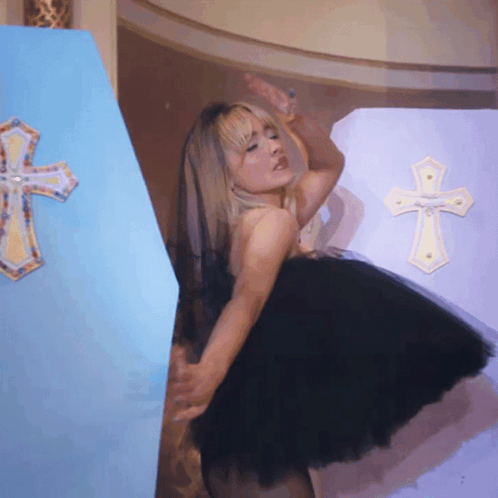 Woman In Black Dress Beside Blue Coffin GIF
