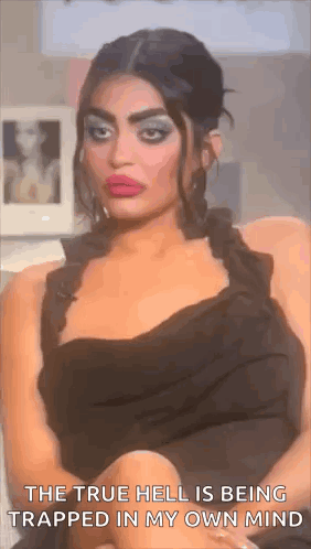 Woman In Black Dress Crosses Legs Says True Hell Trapped In My Own Mind GIF