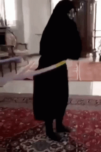 Woman in Black Dress Dancing With Hula Hoop