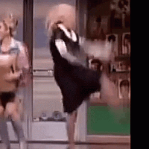 Woman in Black Dress Dancing With Man